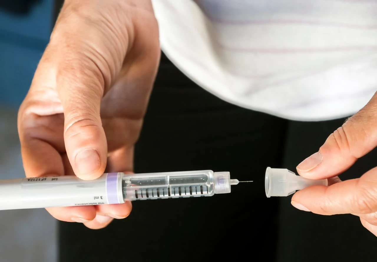 Insulin needle being held by nurse