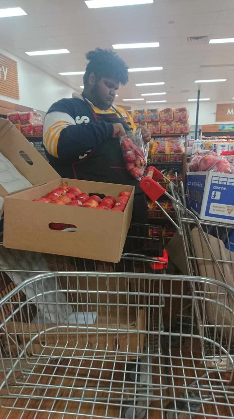 Aboriginal man shopping at local grocery store